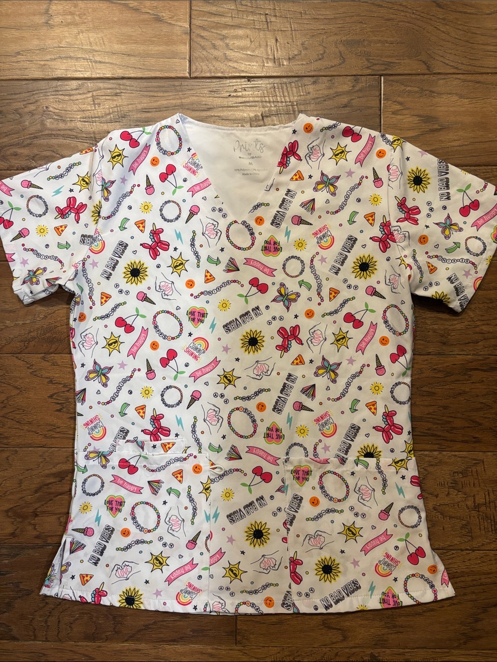 Prints by Scrubaid White Graphic Print V-Neck Scrub Top